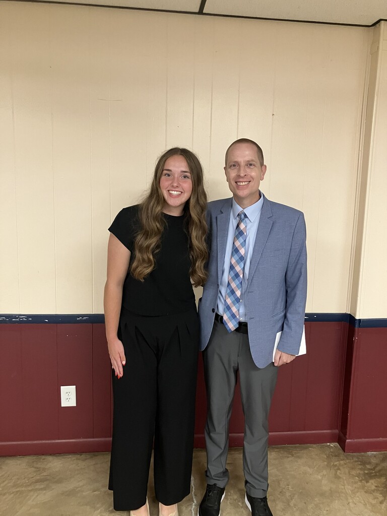 Lydia Colahan posing with WHS principal Mr. Ortman
