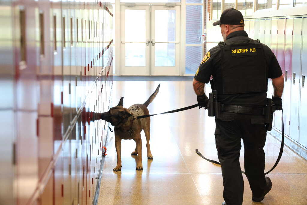 Sgt Daily with K9 Gacki checking lockers