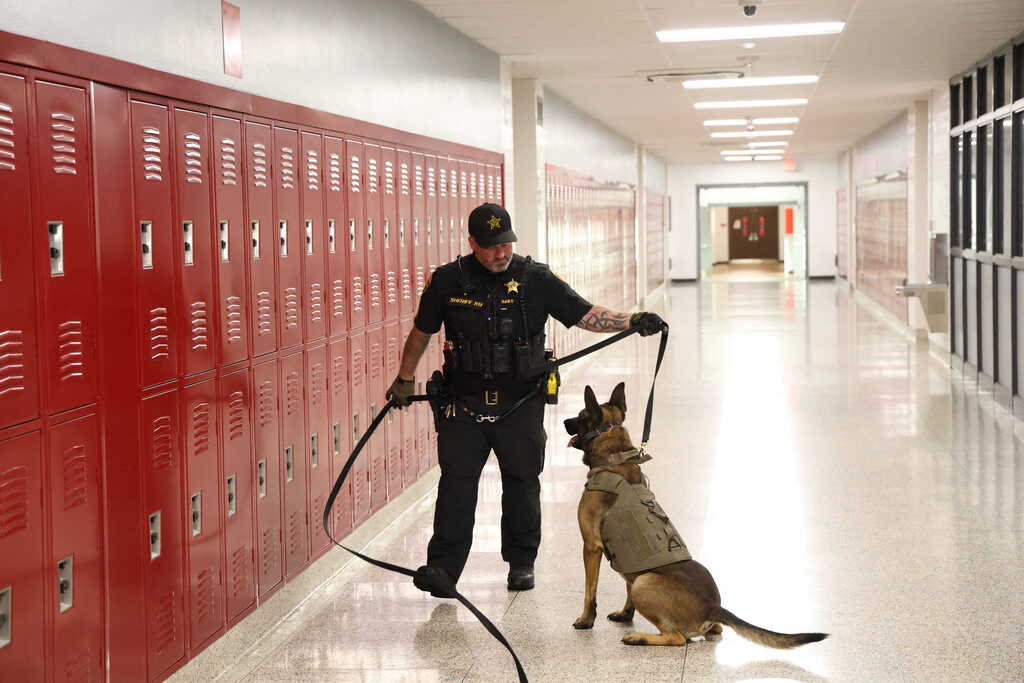 Sgt Daily with K9 Gacki checking lockers