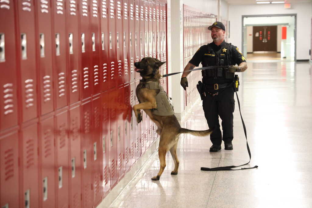 Sgt Daily with K9 Gacki checking lockers