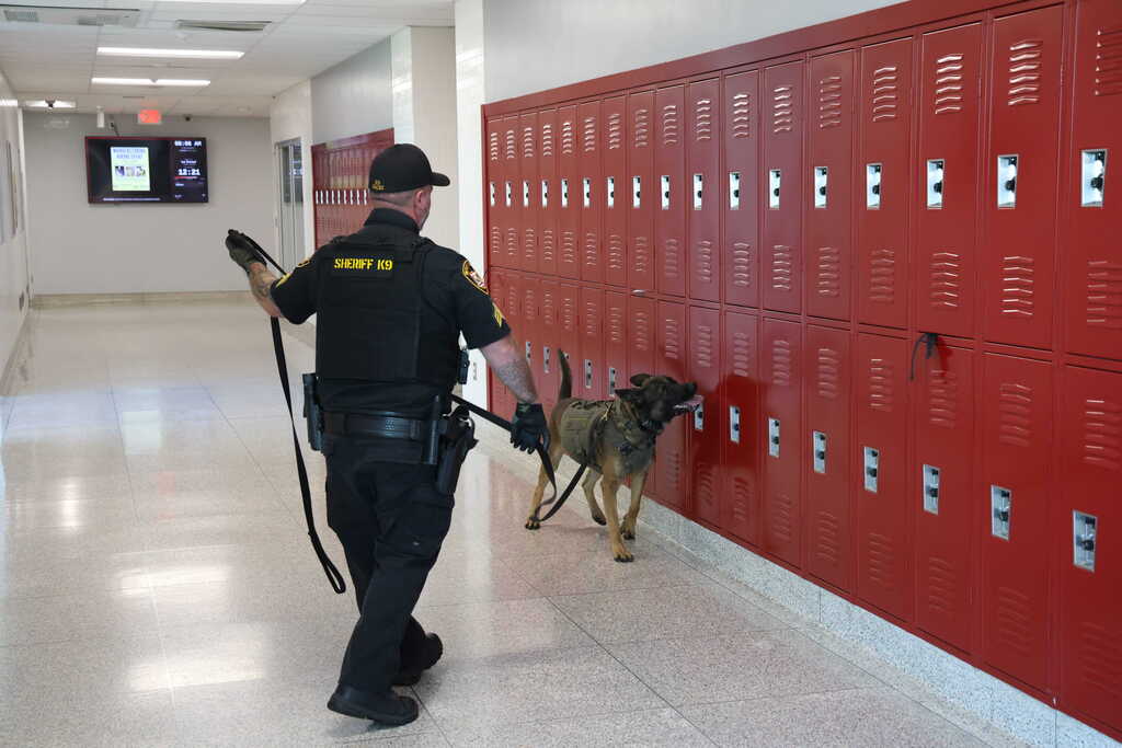 Sgt Daily with K9 Gacki checking lockers