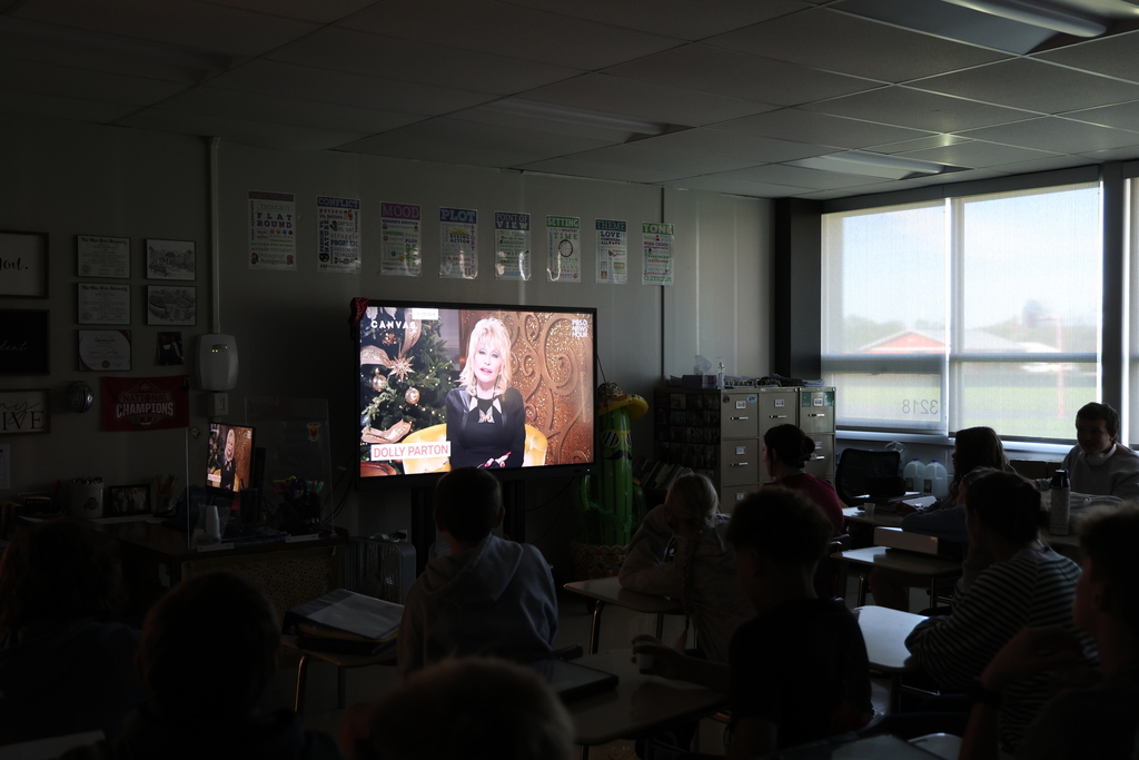 Dolly Parton on the TV screen while students watch