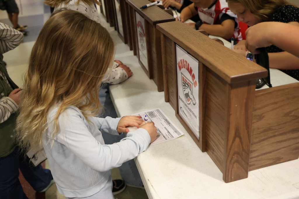 Student conducting bank business at the Student Run Credit Union