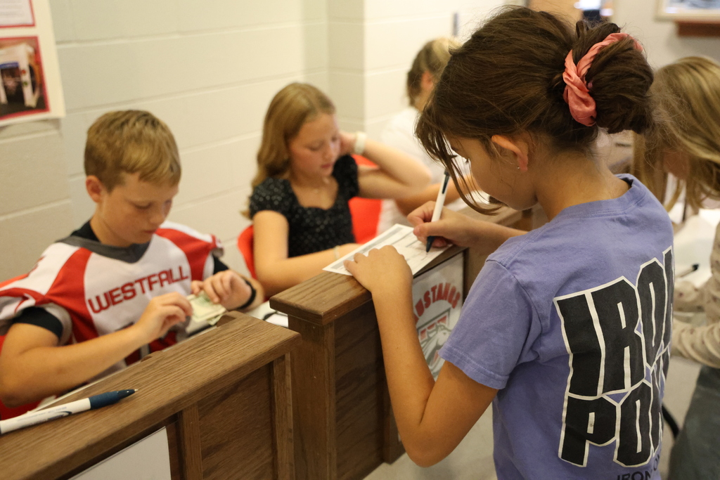 Student conducting bank business at the Student Run Credit Union
