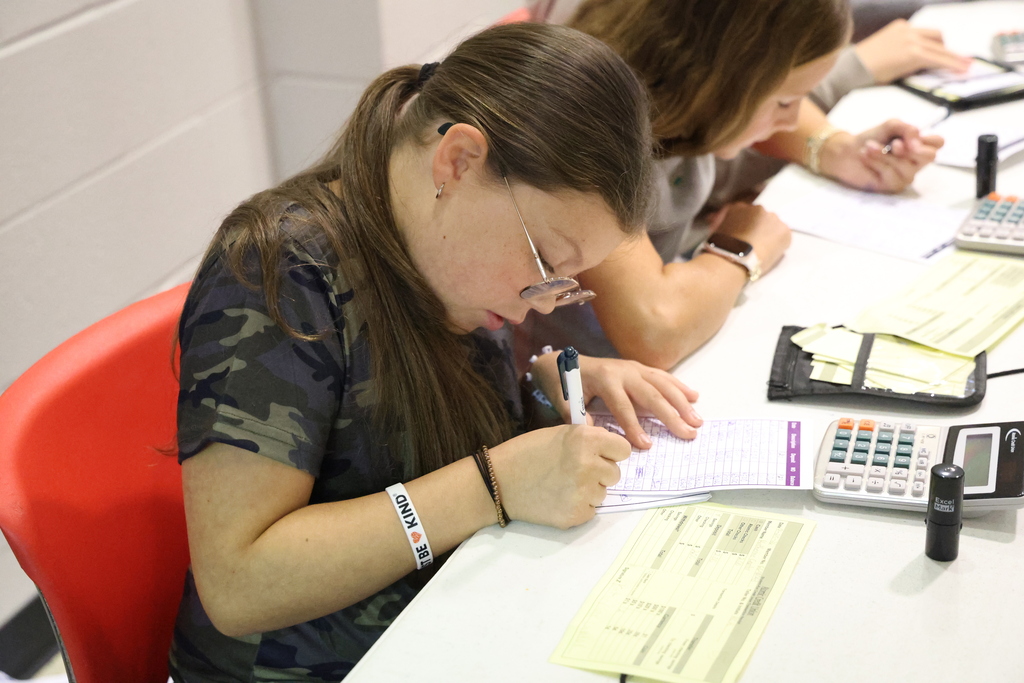 Student conducting bank business at the Student Run Credit Union