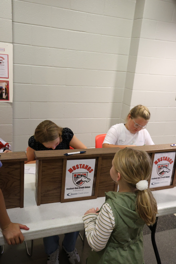 Student conducting bank business at the Student Run Credit Union