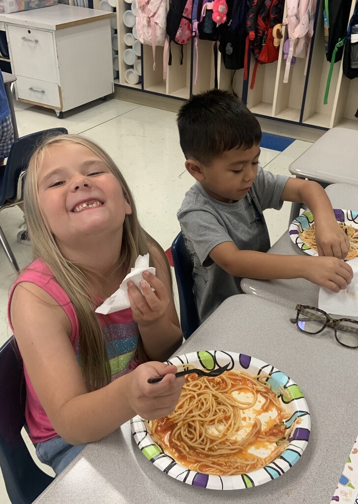 Students eating spaghetti