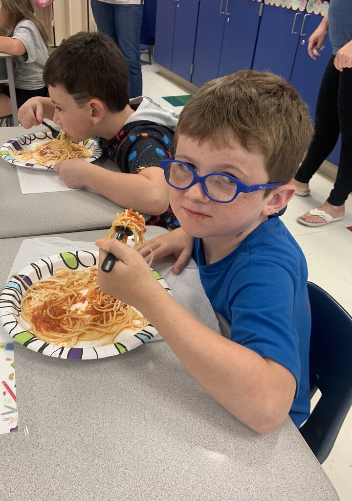 Student eating spaghetti