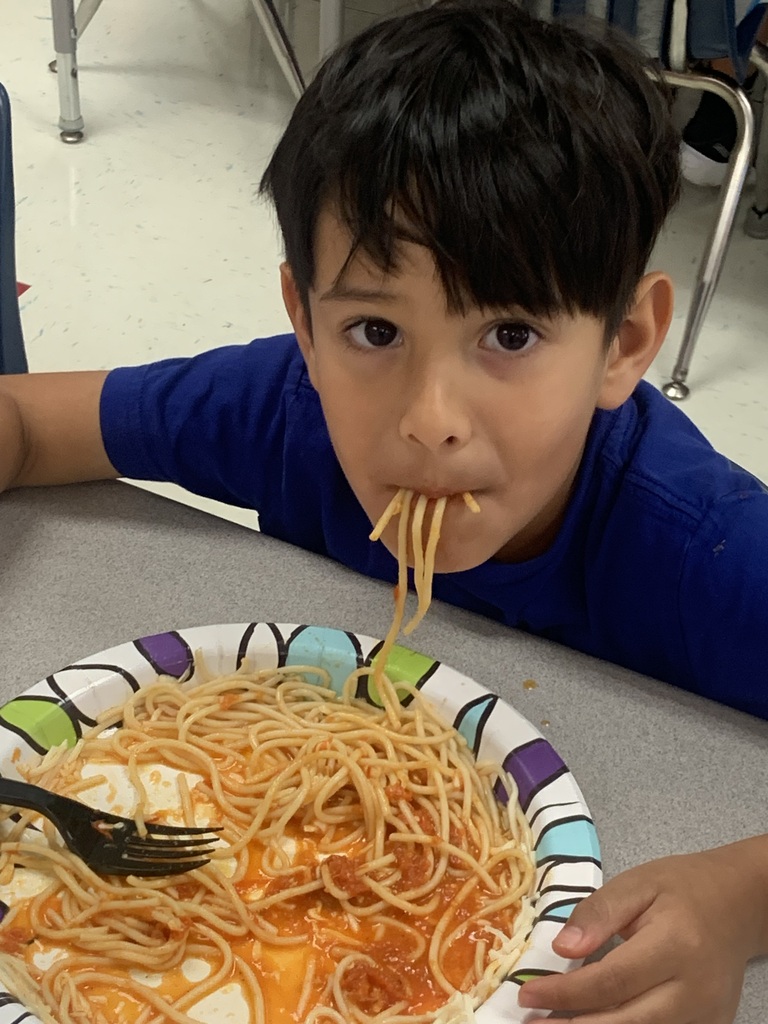 Student eating spaghetti