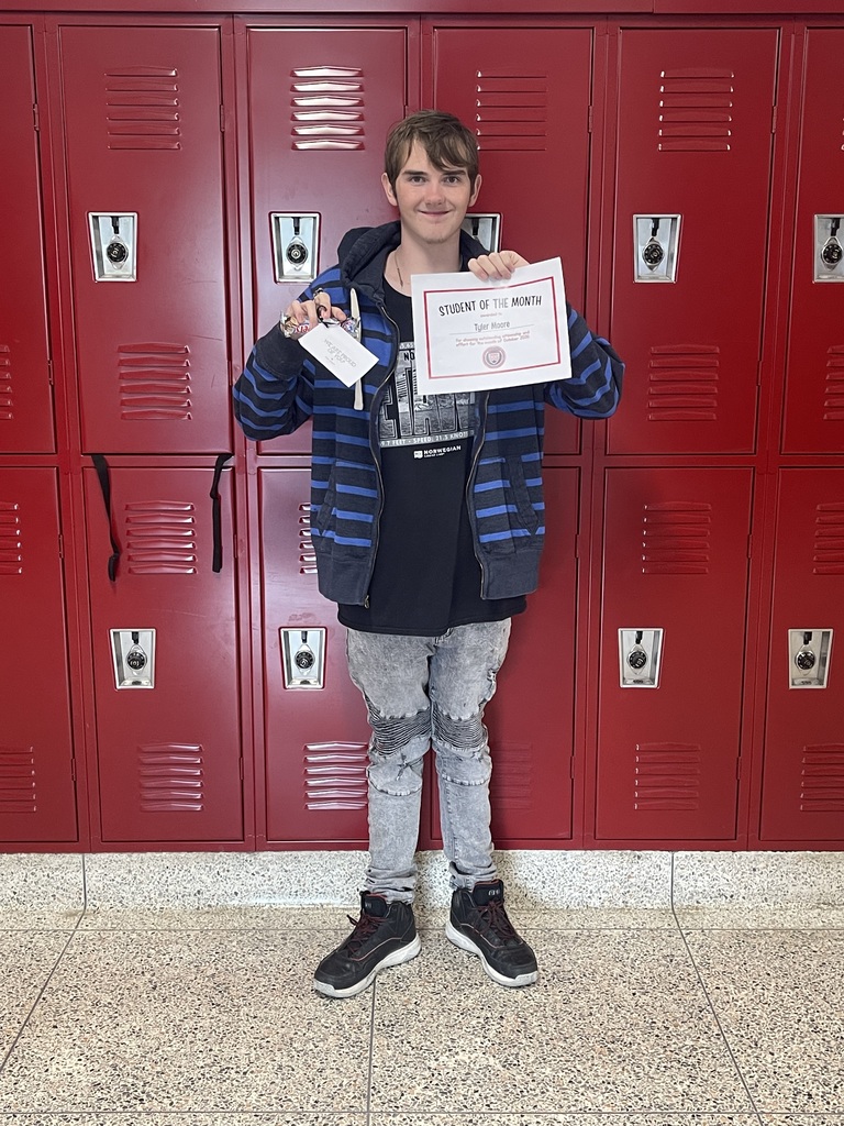 Student of the Month holding certificate
