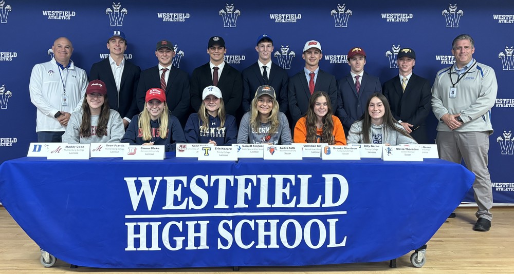 Group photo of student athletes at NLI signing day event