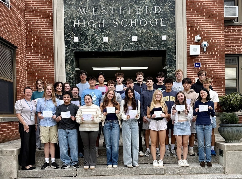 Students on the steps of WHS with Principal