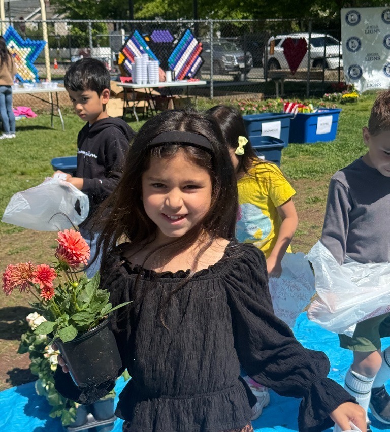 student enjoys the flower patch