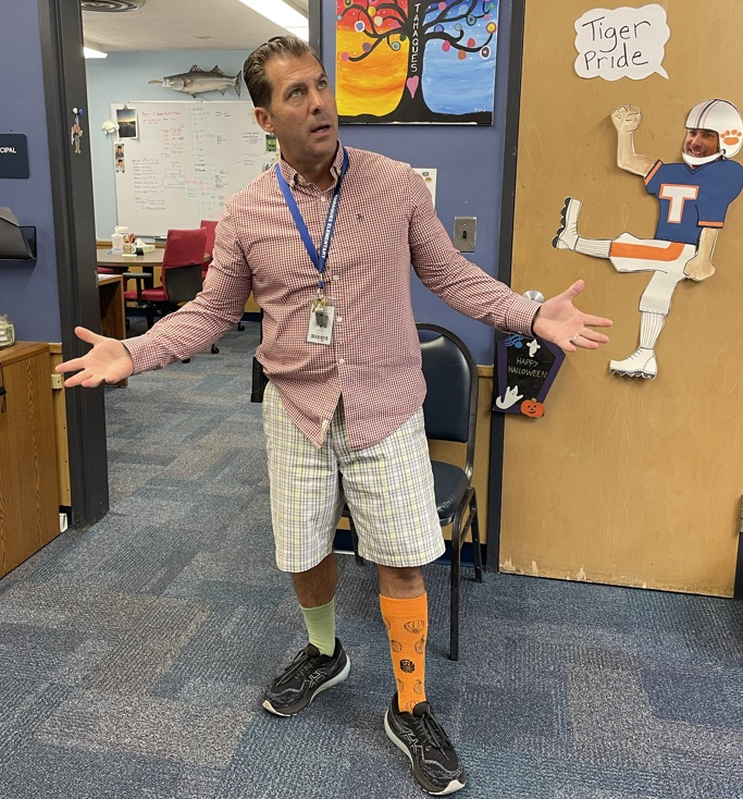 Tamaques principal wearing mismatched clothes for Week of Respect