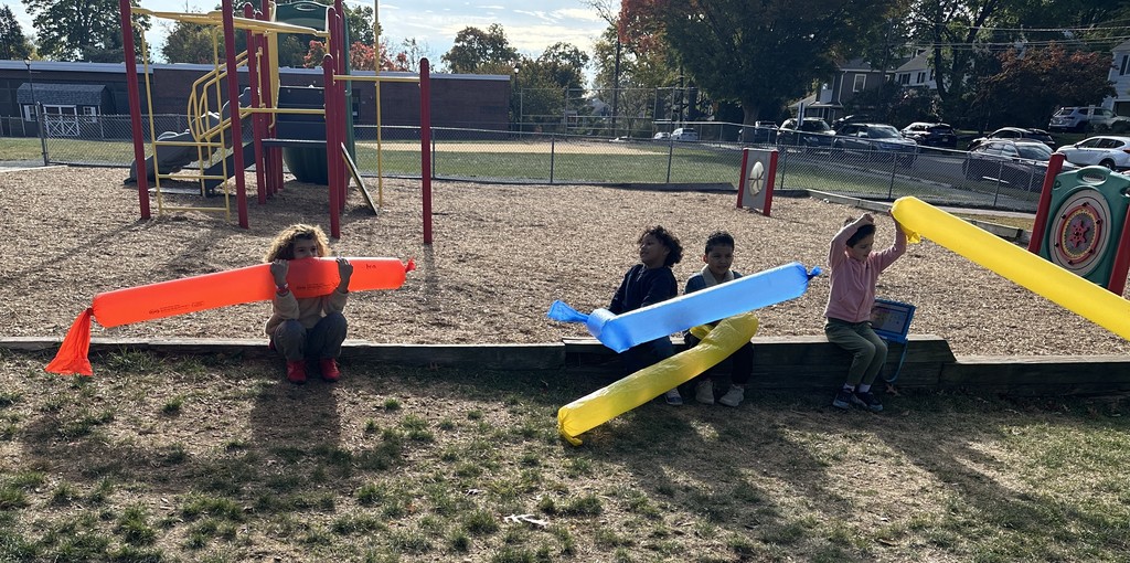 students sitting with wind sock