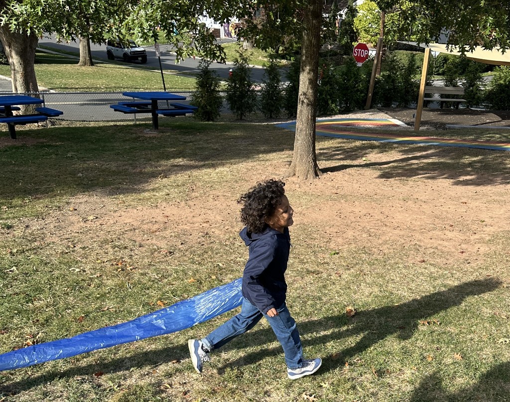student running with wind sock