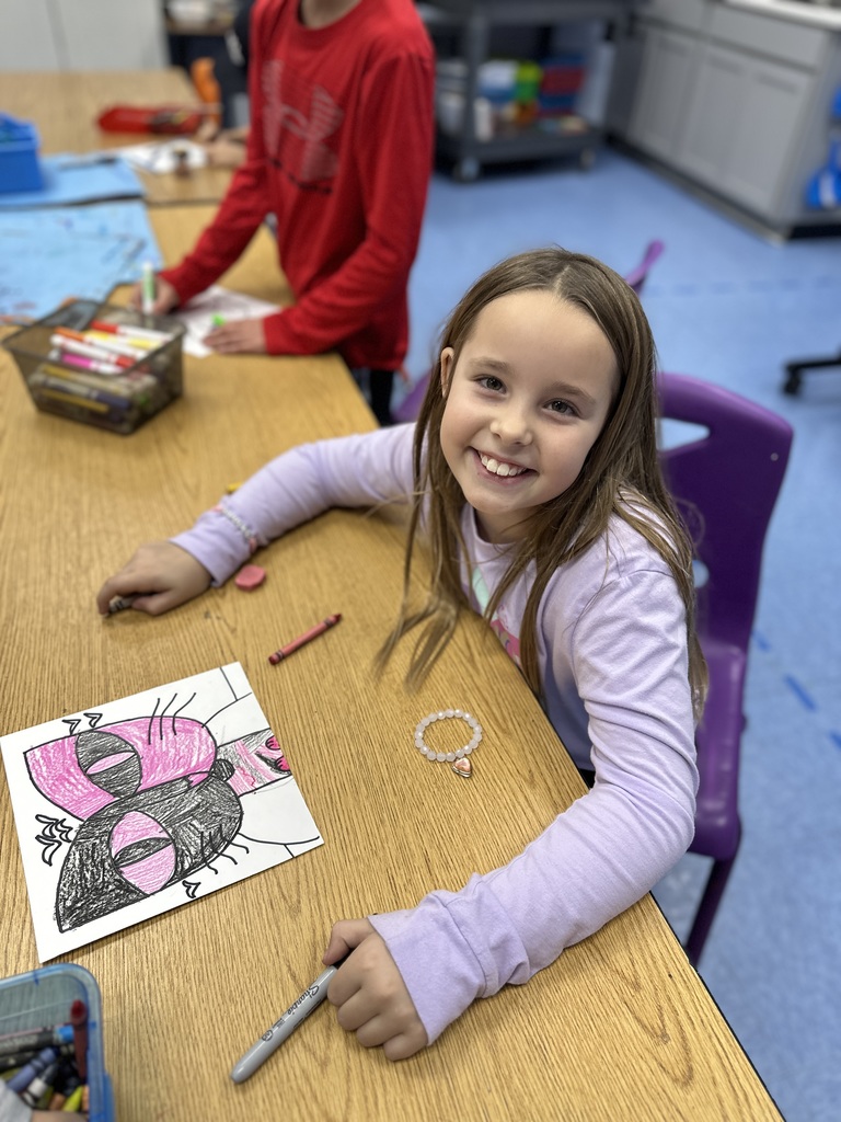 student working on their Cat and Bird art