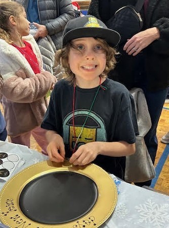 Wilson student working on holiday craft