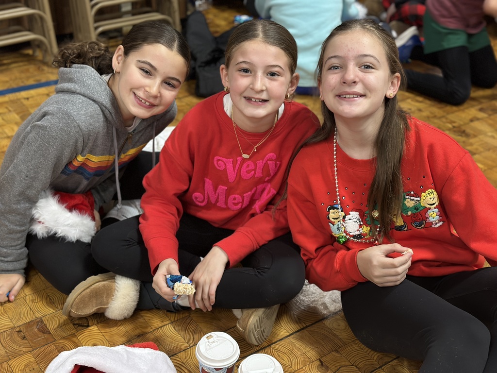 5th grade students sitting in the gym after performance