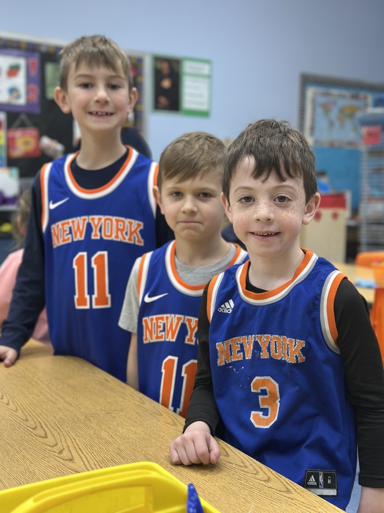  3 students in sports jerseys