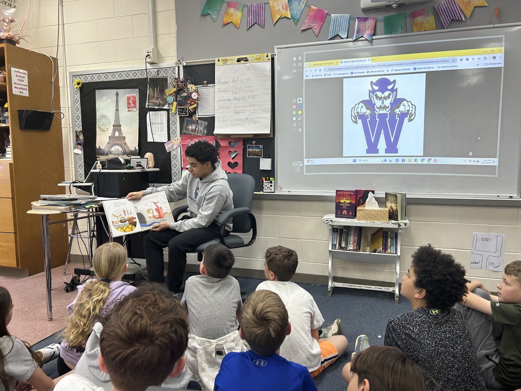 WHS athlete reads to students.