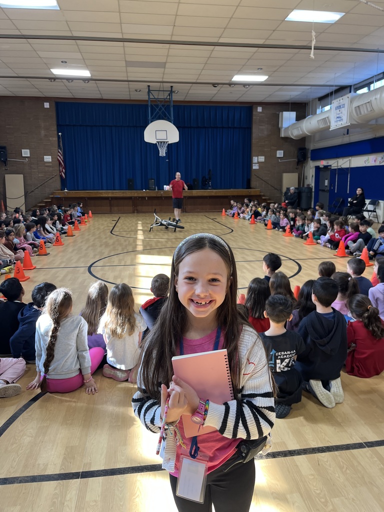 Student acting as the Assistant Principal for the Day and watching the assembly.