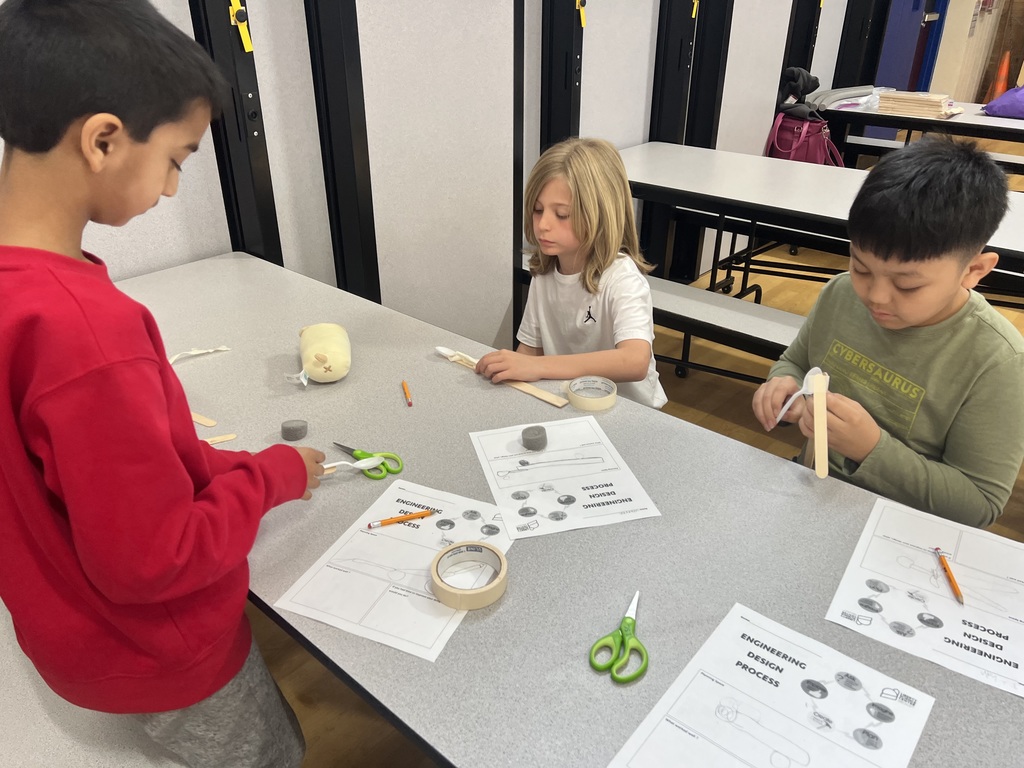 Students experimenting with simple machines.