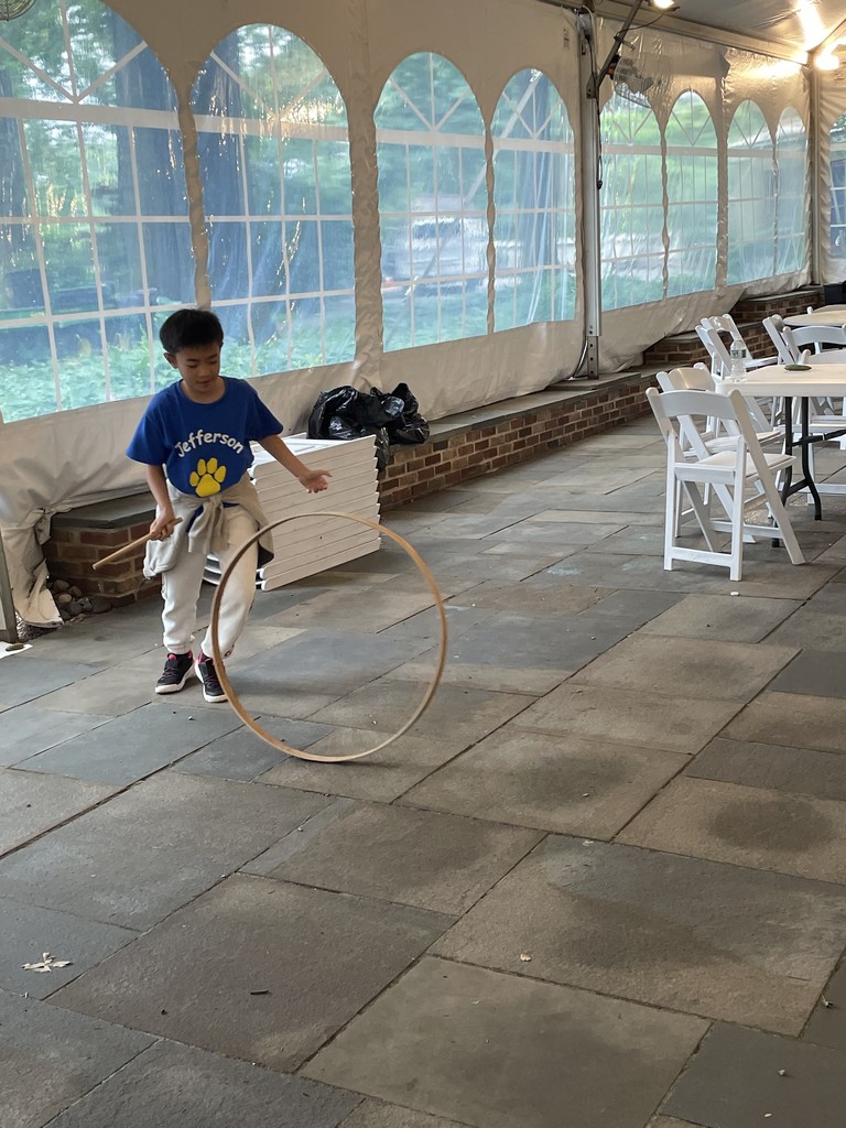 Students playing with toys from the past.