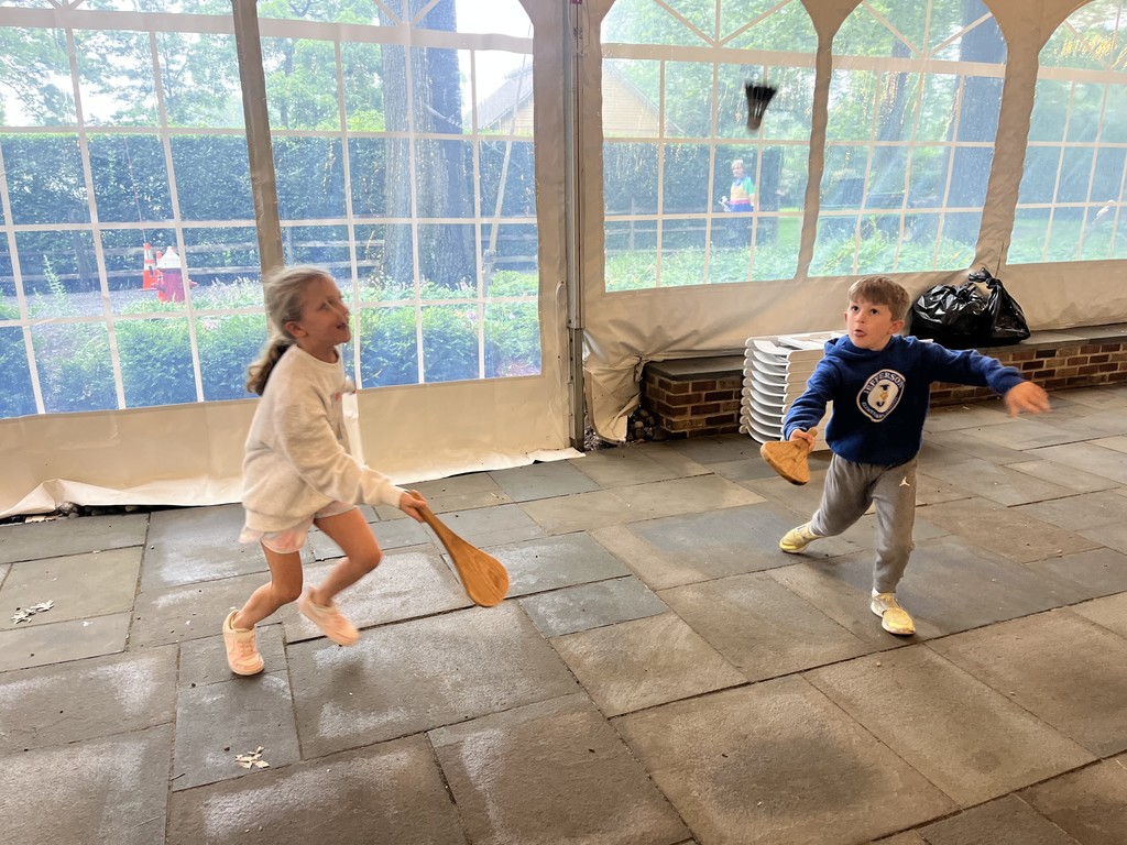Students playing with toys from the past.