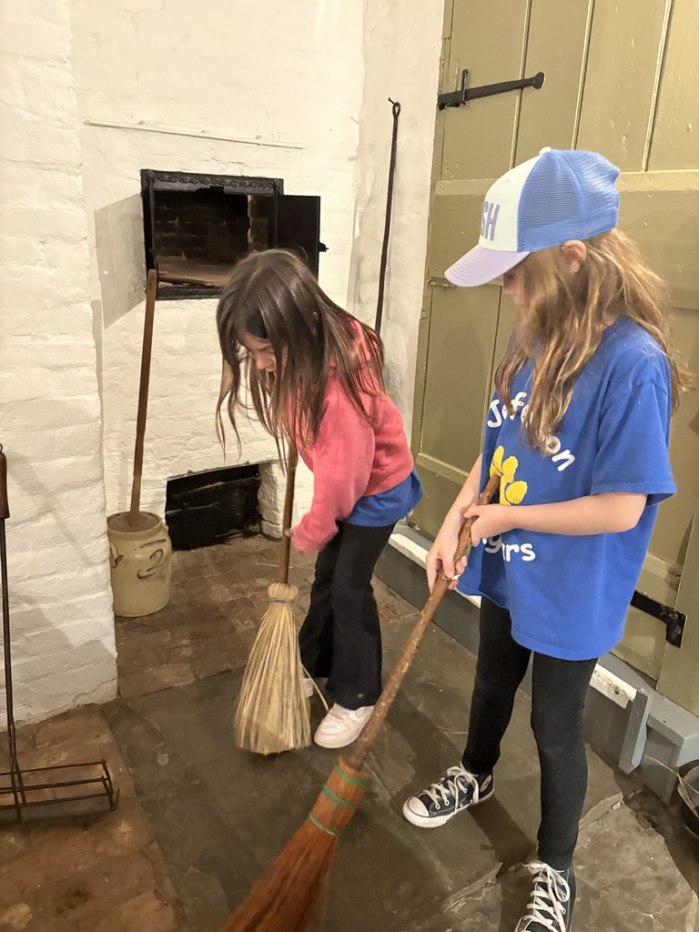 Students sweeping.