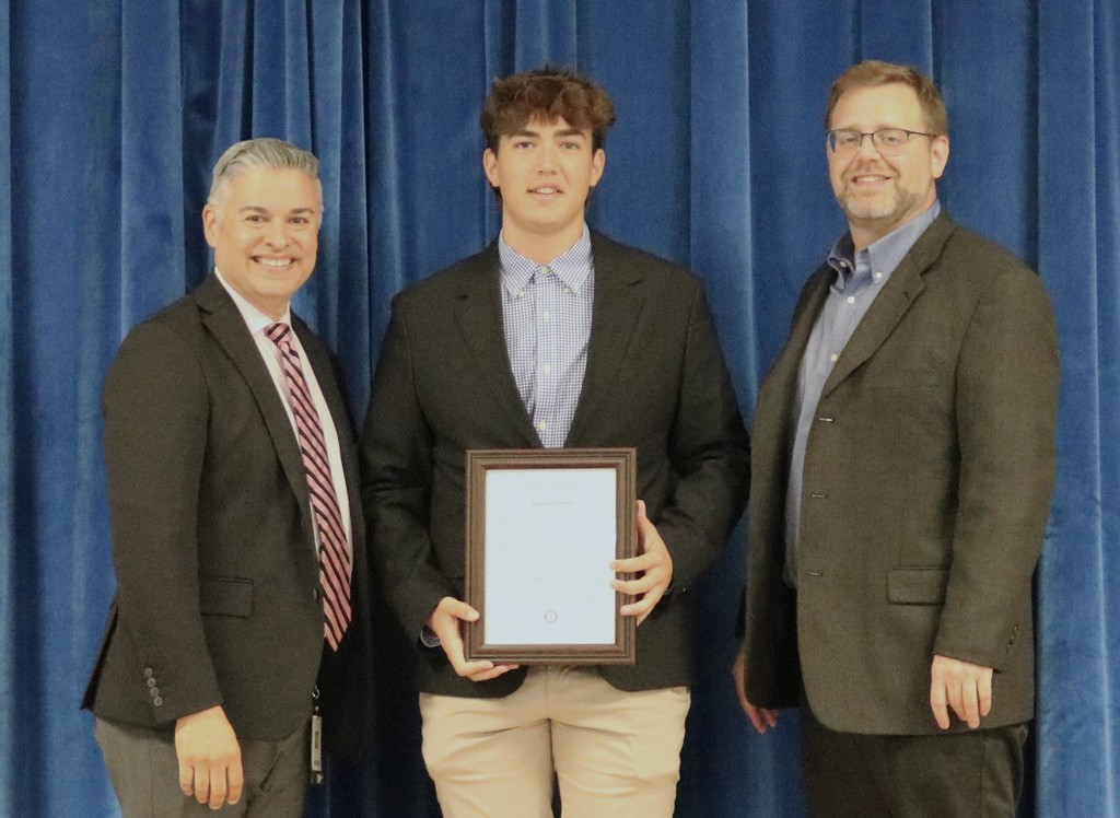Board student rep poses for picture with board president and superintendent