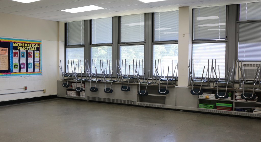 Empty classroom with chairs on windowsill