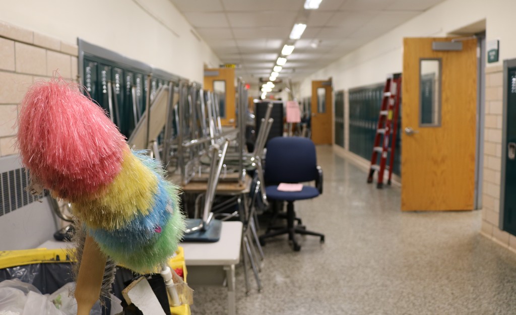 Classroom furniture neatly stacked in hallway