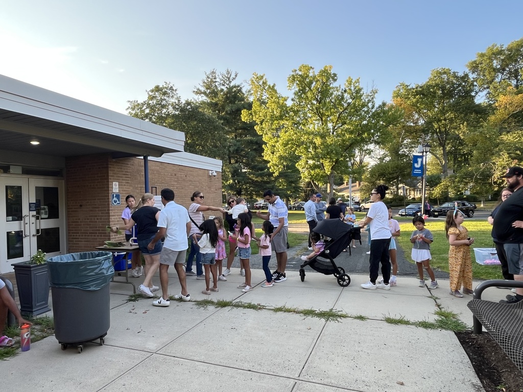 Students waiting on line to pick their ice pop flavor. 