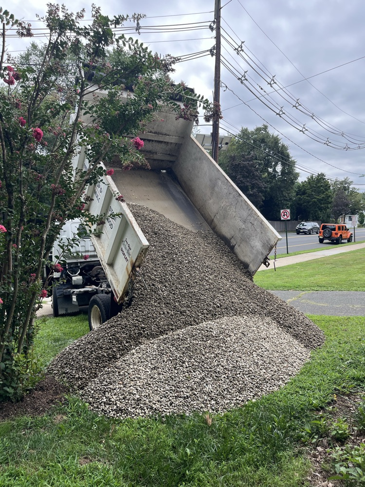 landscaping pebbles getting dumped