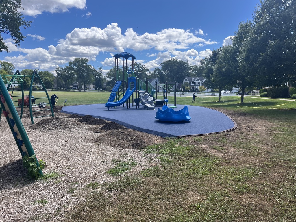 The beautiful blue rubber mulch has been poured.