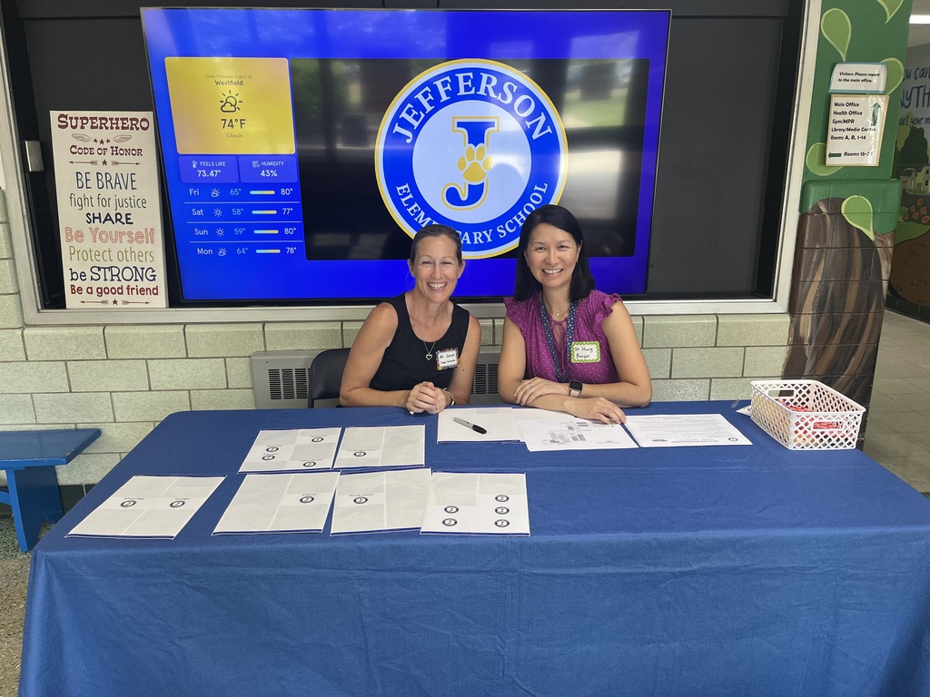 The school counselor and principal greet the students for the event.