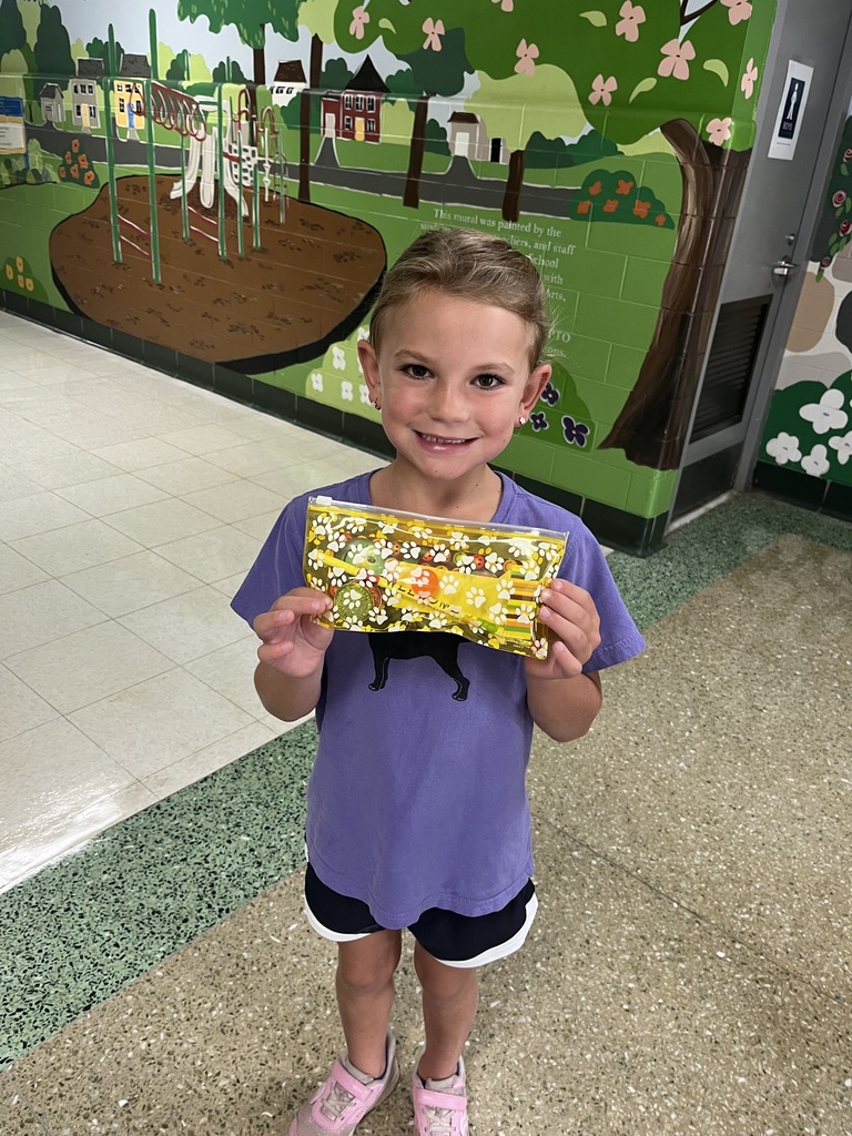 New first grader is happy with her filled pencil case after the Scavenger Hunt.