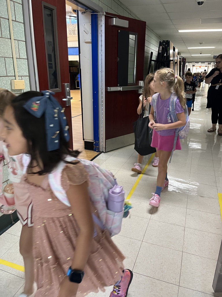 2nd graders are walking to their classroom.
