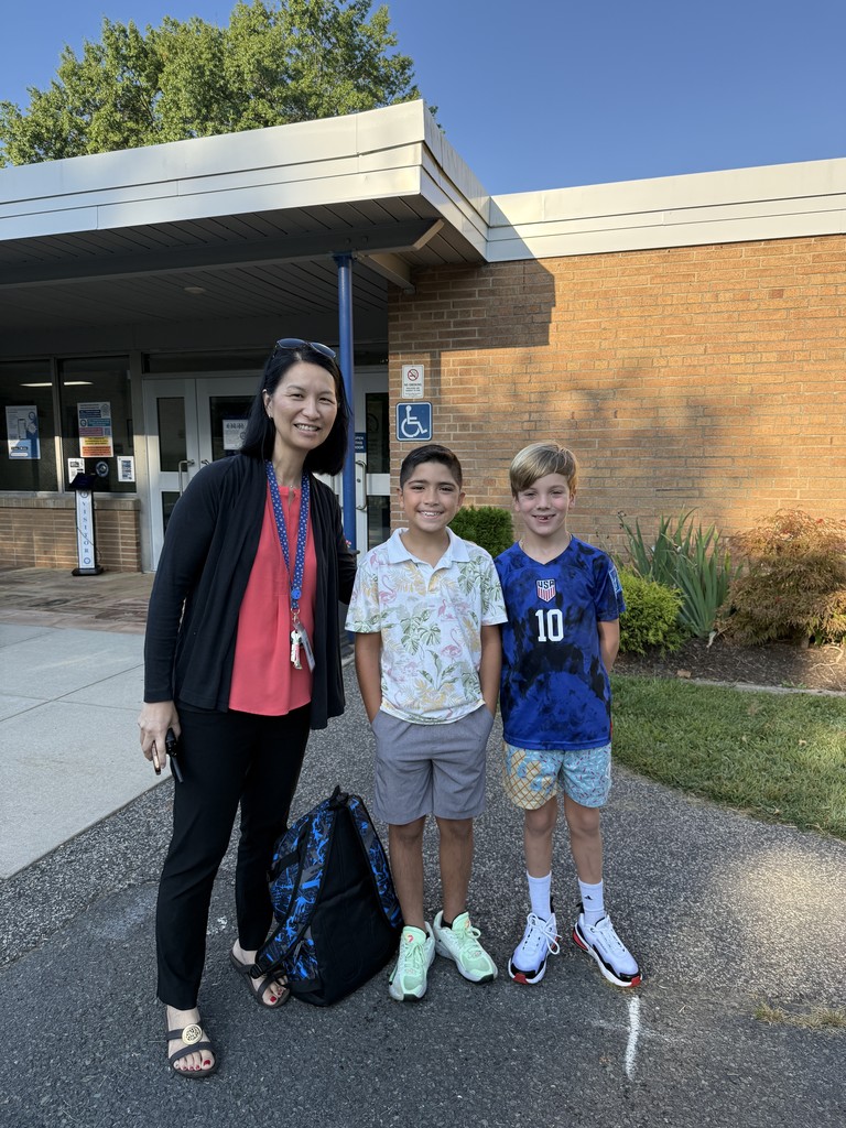 Principal and two 4th graders are ready to start the day!