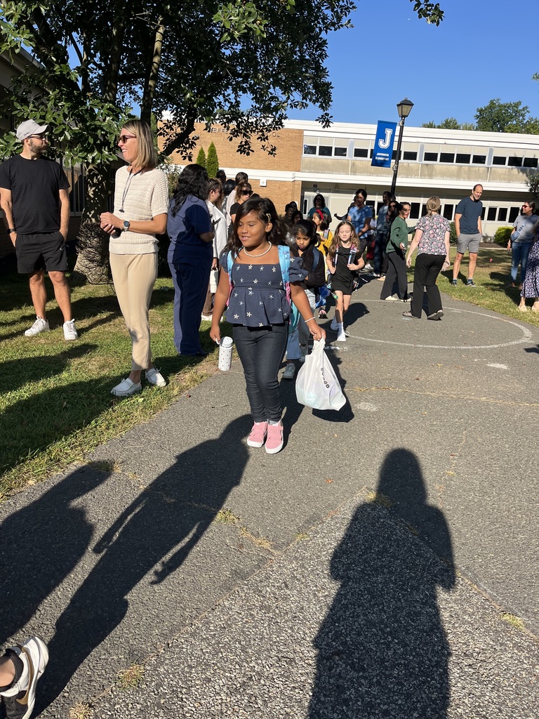 Third graders walking into school.