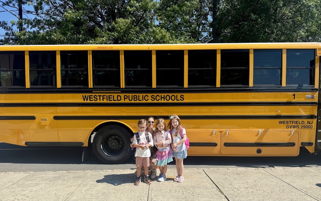 School bus with principal and students
