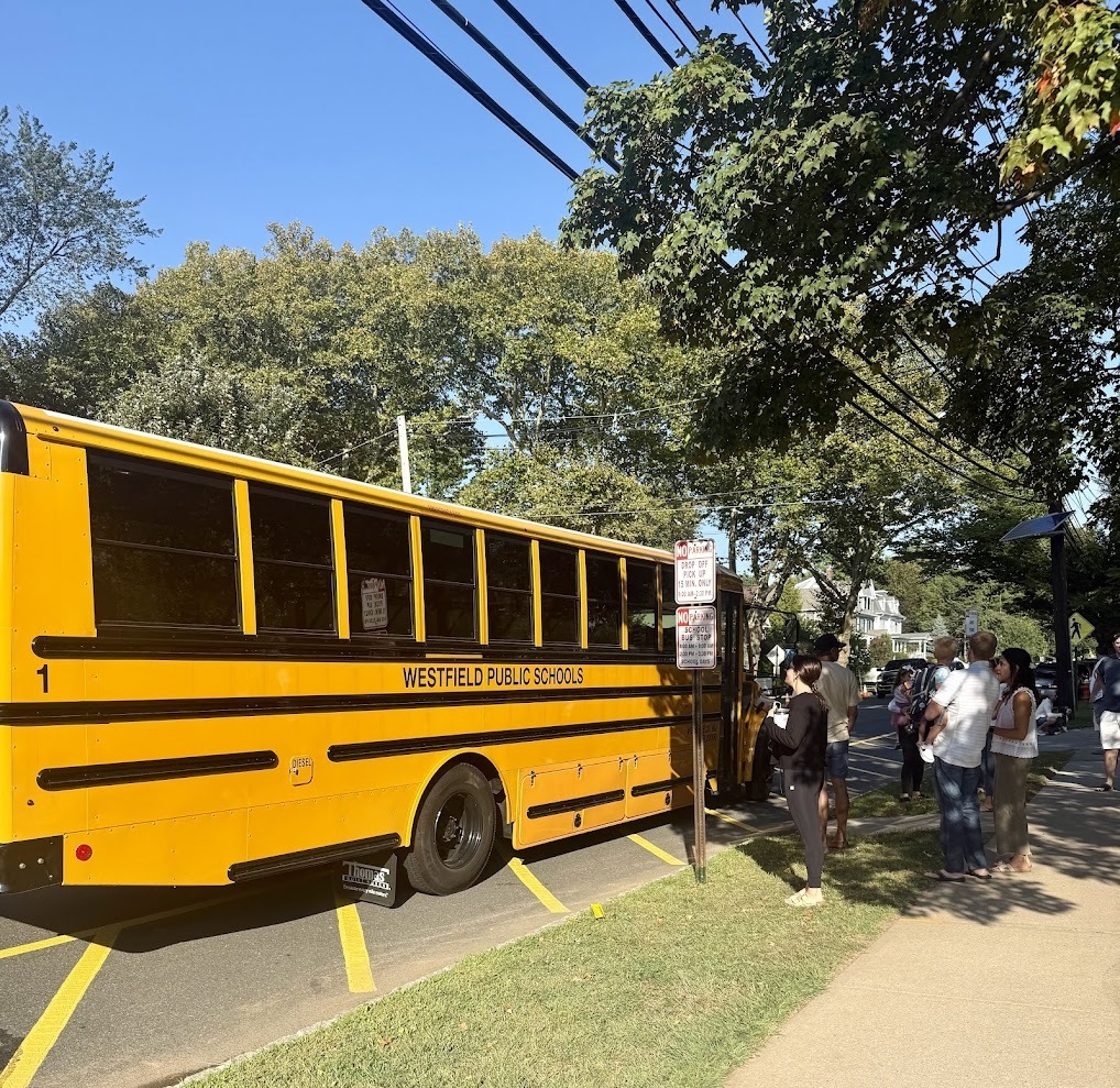 Parents putting children on the school bus