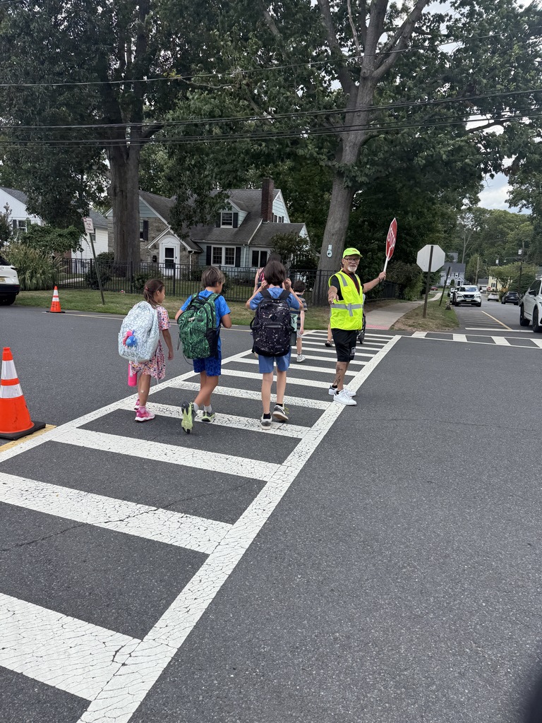 Crossing guard and students