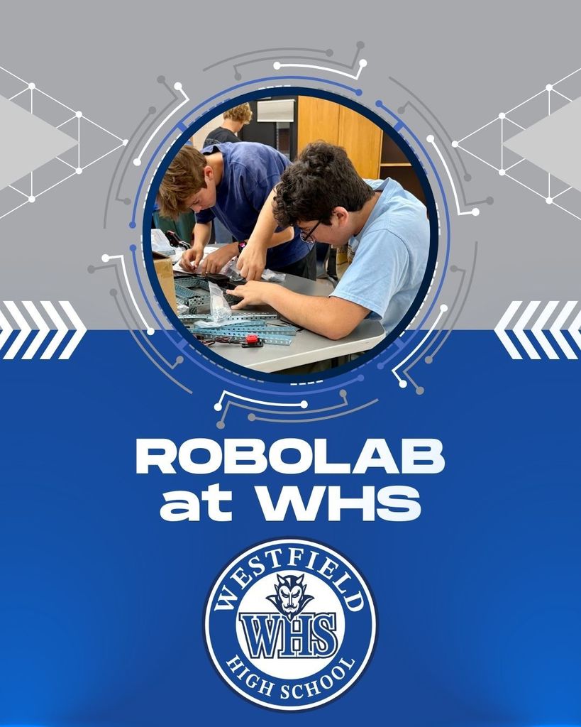 Students building robots at Westfield High School with WHS logo