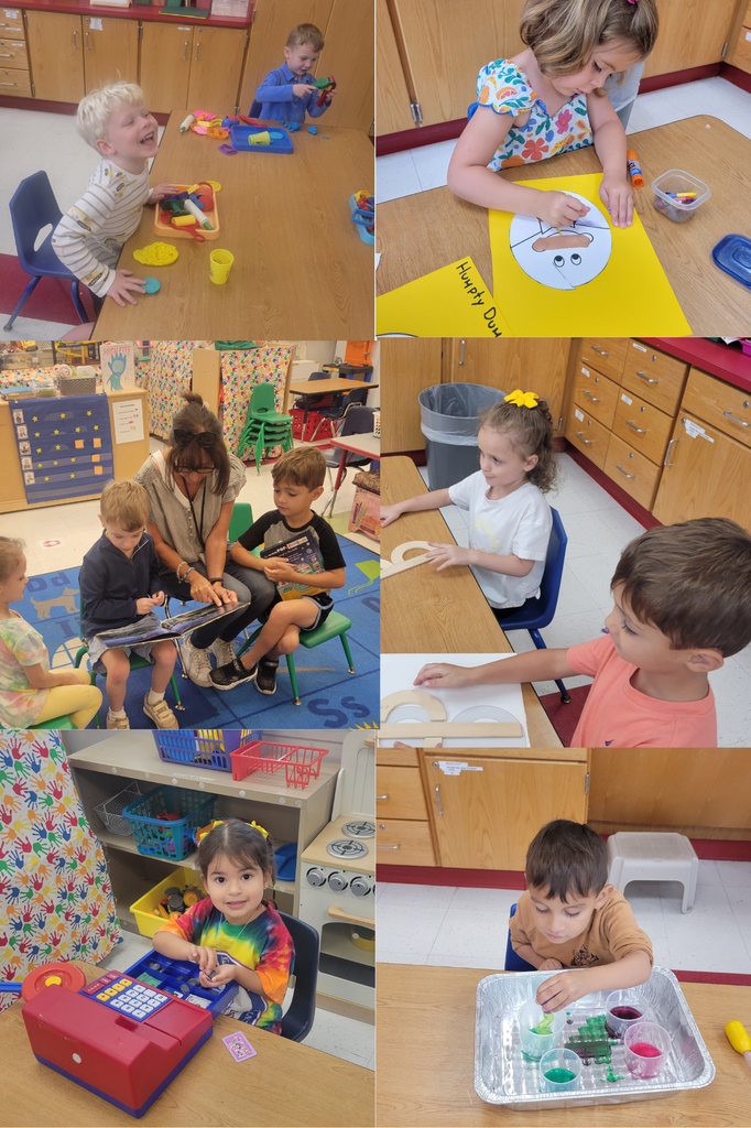 Pre-K students engaged in play centers