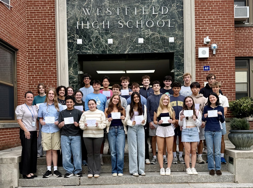 Senior students and WHS Principal Asfendis take a photo to celebrate receiving their Commended Student certificates.