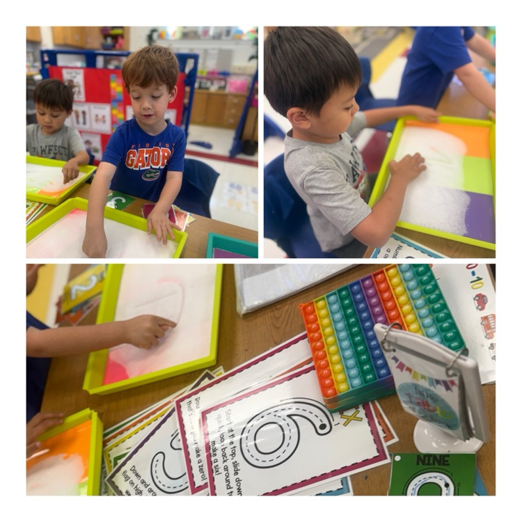 students engage in math centers.