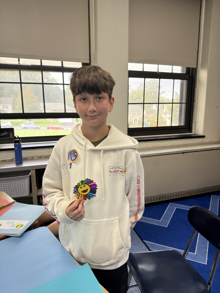 student holding their flower