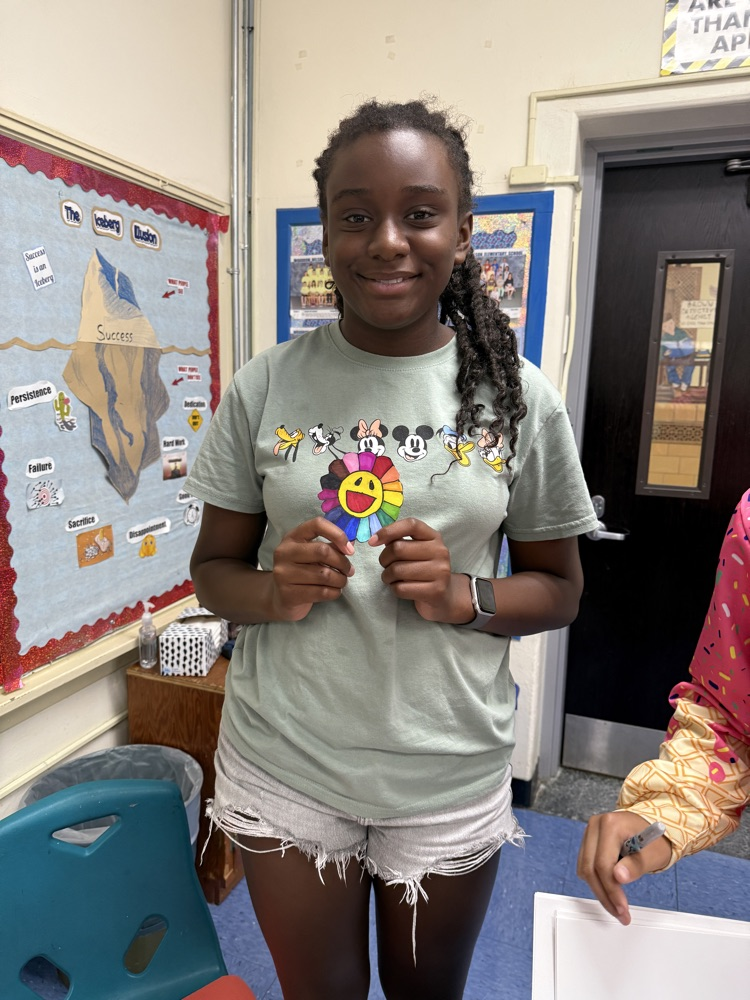student holding their flower